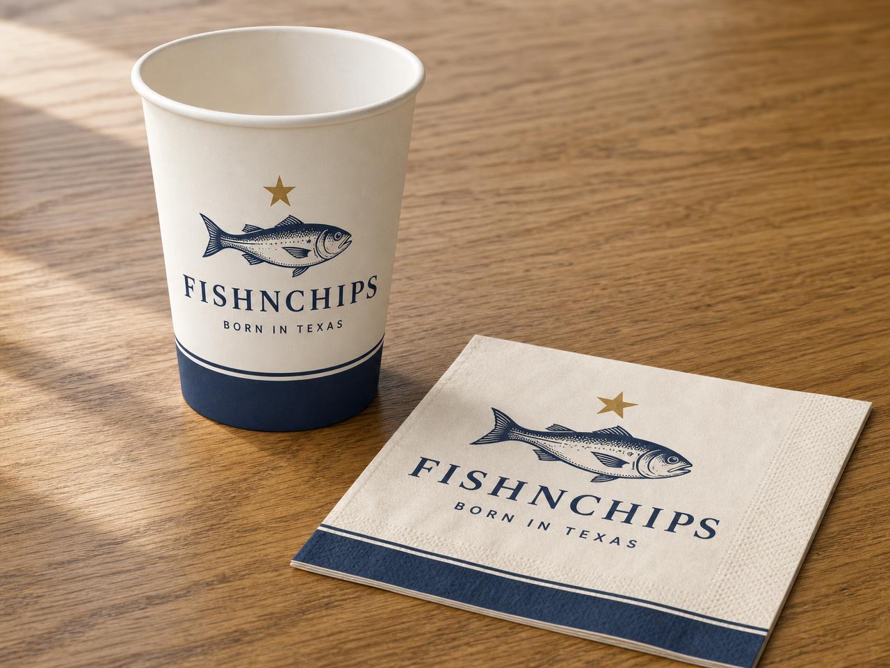 Cups & napkins in FishNChips navy, cream and gold branding